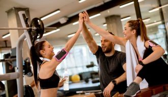 Cheerful young fitness team in the gym